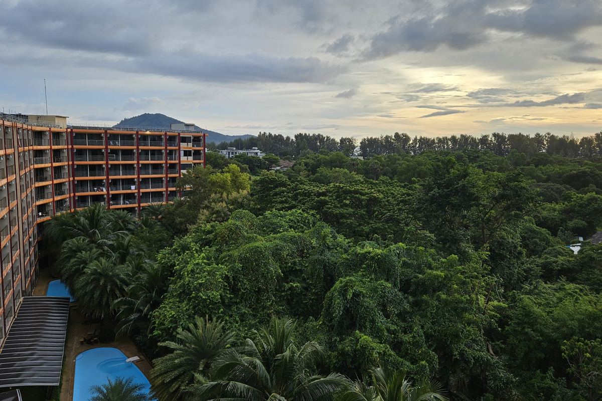 Mai Khao Beach Condotel beside the forest, hills behind